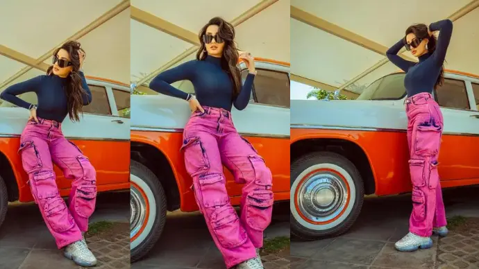 Nora Fatehi in blue top and pink-blue cargo pants